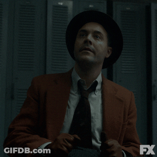 Man Wearing Suit Ear Plugs GIF