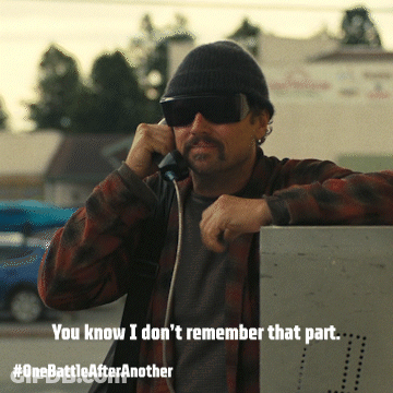Man Wearing Sunglasses And Beanie Talking On Phone GIF