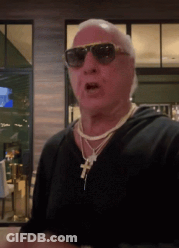 Man Wearing Sunglasses And Cross Necklace GIF
