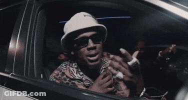 Man Wearing Sunglasses And Hat In Car GIF