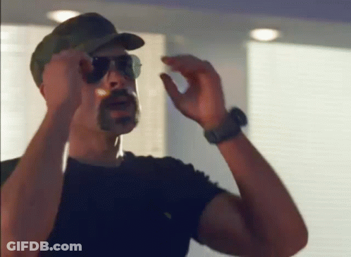 Man Wearing Sunglasses And Hat Smoking Cigar GIF