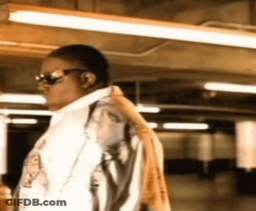 Man Wearing Sunglasses And Headphones Standing In Room GIF