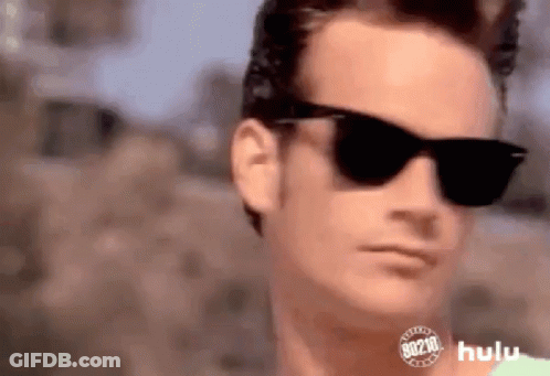 Man Wearing Sunglasses And Hulu Logo GIF
