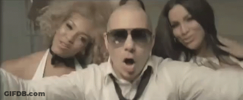 Man Wearing Sunglasses Between Two Women GIF