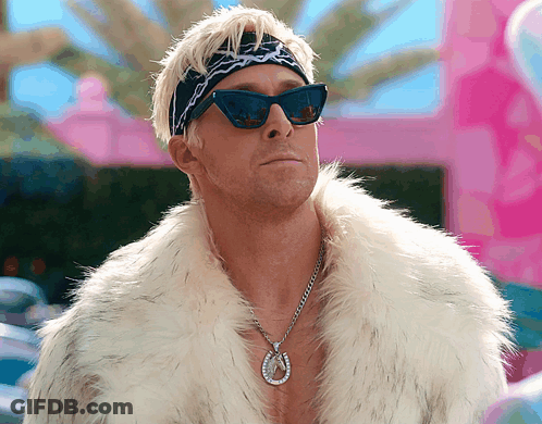 Man Wearing Sunglasses Fur Coat And Horseshoe Necklace GIF