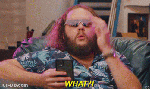 Man Wearing Sunglasses Holding Cell Phone Saying What GIF