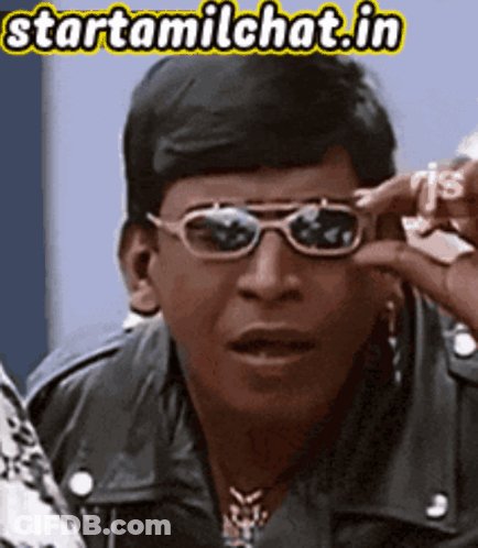 Man Wearing Sunglasses Holding Dollar Sign GIF