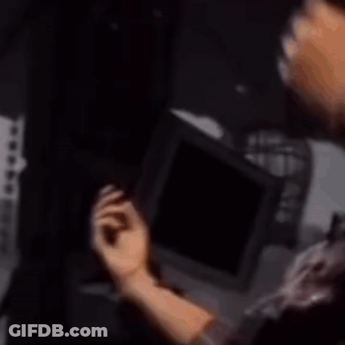 Man Wearing Sunglasses Holding Oscar GIF