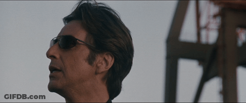 Man Wearing Sunglasses In Front Of Building GIF