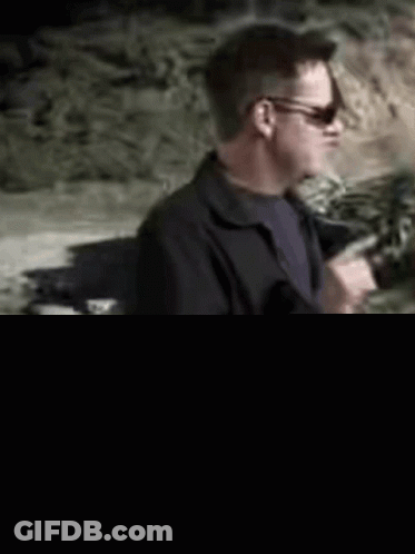 Man Wearing Sunglasses In Front Of Money GIF