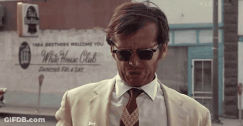 Man Wearing Sunglasses In Front Of White House Club Sign GIF