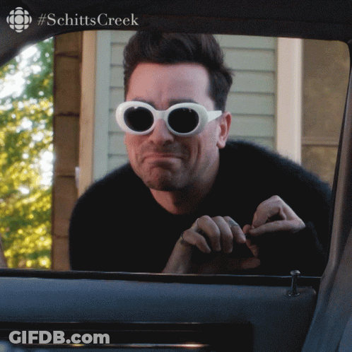 Man Wearing Sunglasses Looking Out Car Window GIF