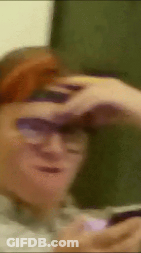 Man Wearing Sunglasses Looking Through Binoculars GIF