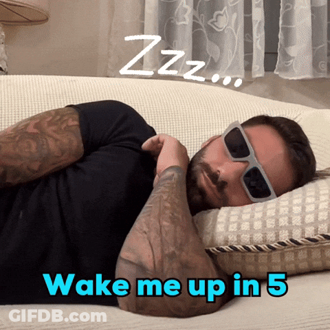 Man Wearing Sunglasses Lying On Couch Wake Me Up In 5 GIF