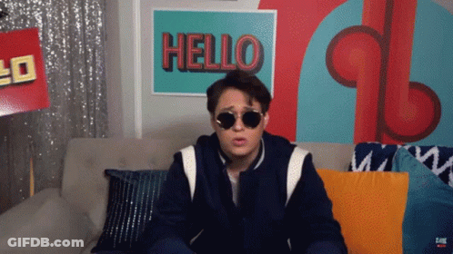 Man Wearing Sunglasses Sitting On Couch GIF