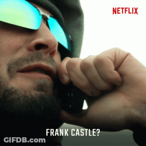 Man Wearing Sunglasses Talking On Phone GIF