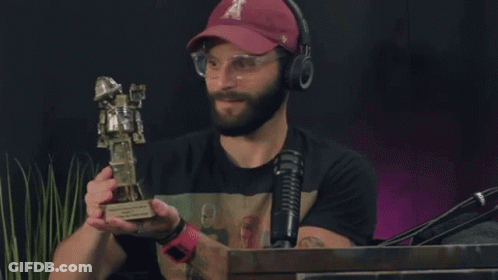 Man Wearing T Hat Holding Trophy GIF