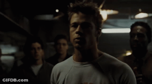 Man Wearing T-Shirt With Letter K In Crowd GIF
