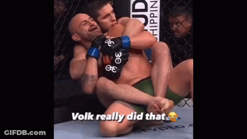Man Wearing UFC Glove Covers Face In Dark GIF