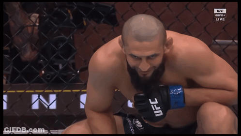 Man Wearing UFC Gloves Looking Down GIF