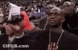 Man Wearing VR Headset In Crowd GIF
