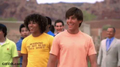 Man Wearing Warning Do Not Read This Shirt Next To Another Man GIF