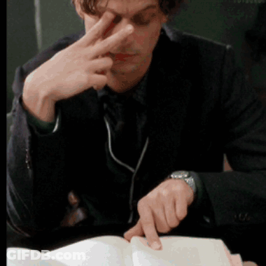 Man Wearing Watch Reading Book With Finger GIF