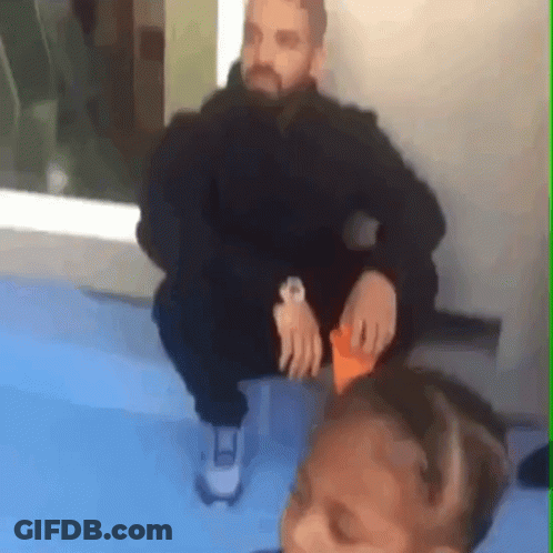 Man Wearing Watch Sitting On Blue Surface GIF