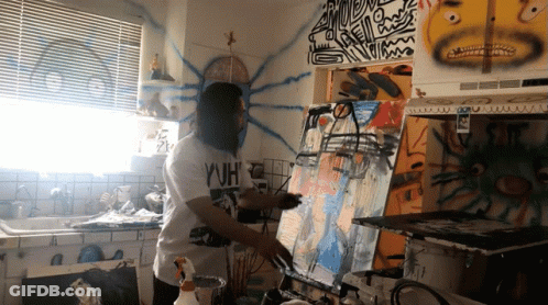 Man Wearing WH Shirt Painting On Canvas GIF