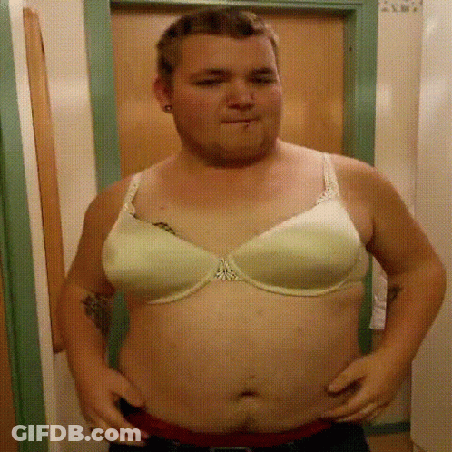 Man Wearing White Bra With Chest Tattoo GIF