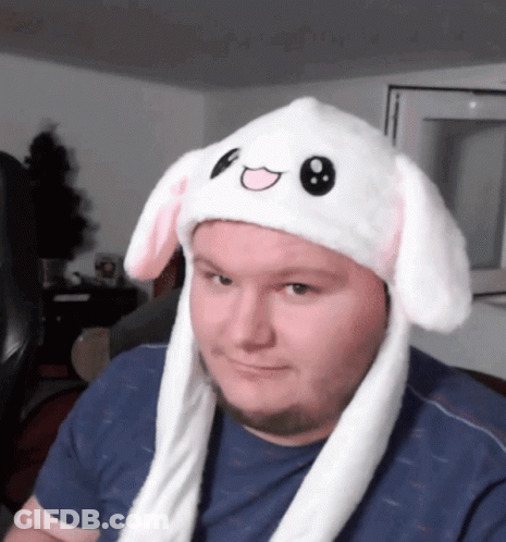 Man Wearing White Bunny Hat With Pink Ears GIF