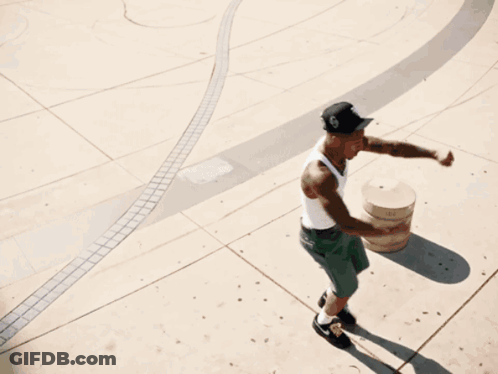 Man Wearing White Tank Top And Black Hat On Skateboard GIF