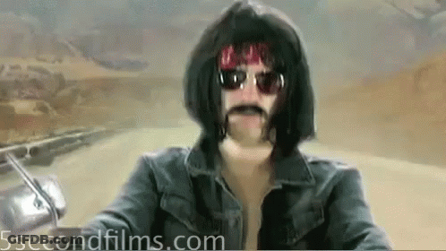 Man Wearing Wig And Sunglasses Riding Motorcycle GIF
