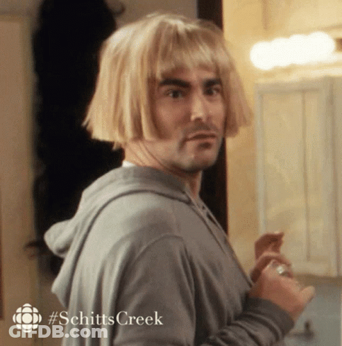 Man Wearing Wig In Front Of Mirror GIF