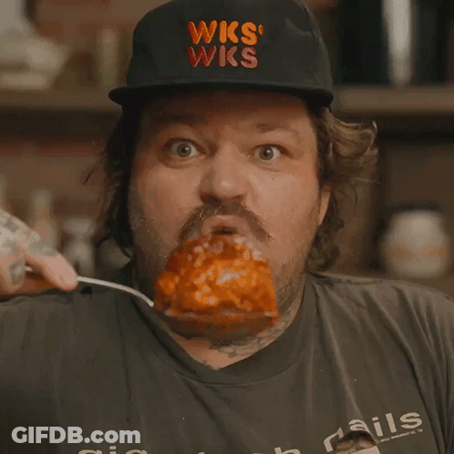 Man Wearing WKS Hat Eating Meat GIF
