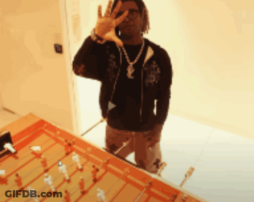 Man Wearing Yves Saint Laurent Necklace Making Peace Sign GIF