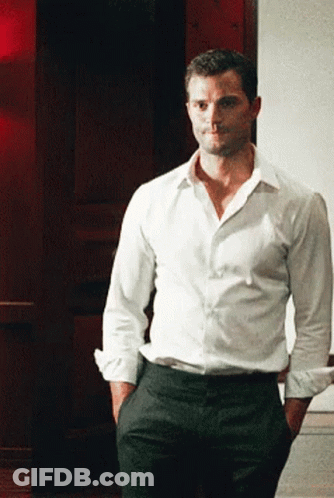 Man White Shirt Black Pants Hands In Pockets GIF