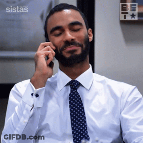 Man White Shirt Tie Talking Phone Sistas Logo GIF