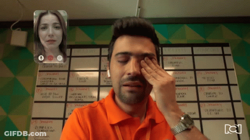 Man Wiping Eyes On Video Call With Woman And Semana Calendar GIF