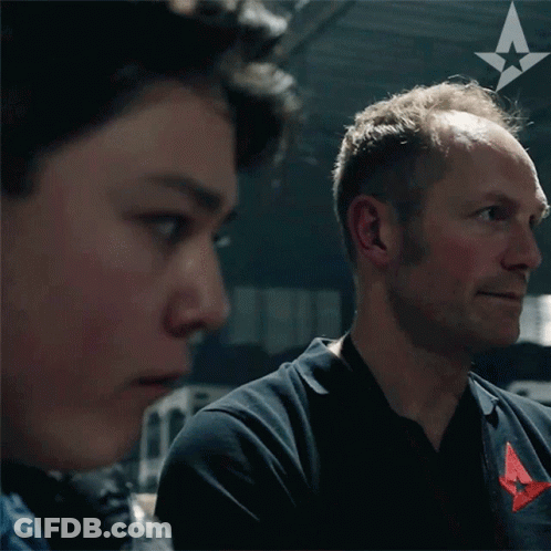 Man With A On Ear Looking At Another GIF