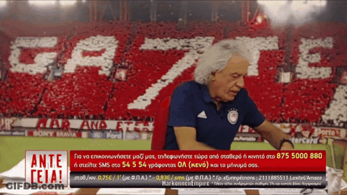 Man With Ante Teia Sign In Front Of Crowd GIF