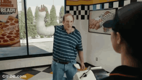 Man With Arm Cast In Front Of Ready Sign GIF
