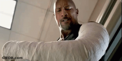 Man With Arm Cast Standing By Window GIF