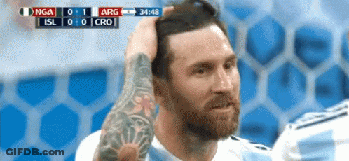 Man With Arm Tattoo Holding Head During Soccer Game GIF