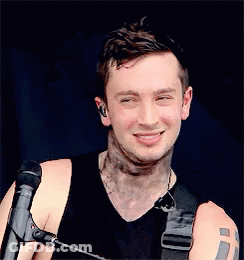 Man With Arm Tattoo Holding Microphone GIF