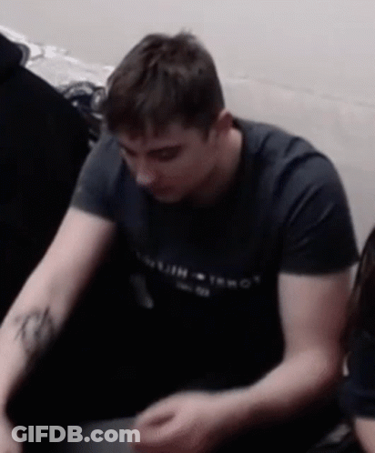 Man With Arm Tattoo In Black Tommy T-Shirt GIF