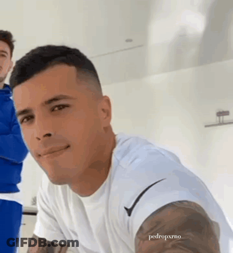 Man With Arm Tattoo In White Nike Shirt GIF