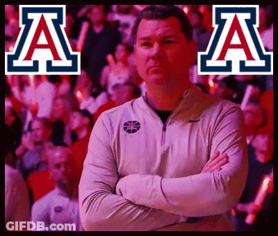 Man With Arms Crossed In Front Of AA Sign GIF