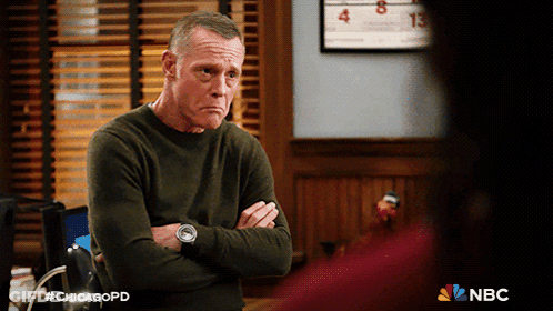 Man With Arms Crossed In Front Of Calendar Saying Chicagopd GIF