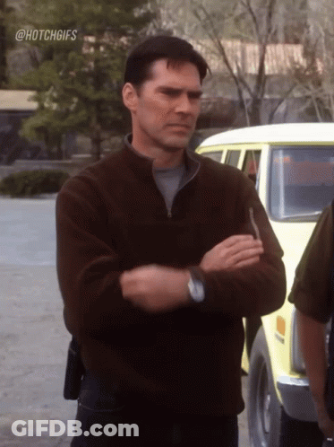 Man With Arms Crossed In Front Of Yellow Van Hashtag Hotchgifs GIF